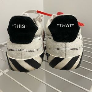 Off-white sneakers.